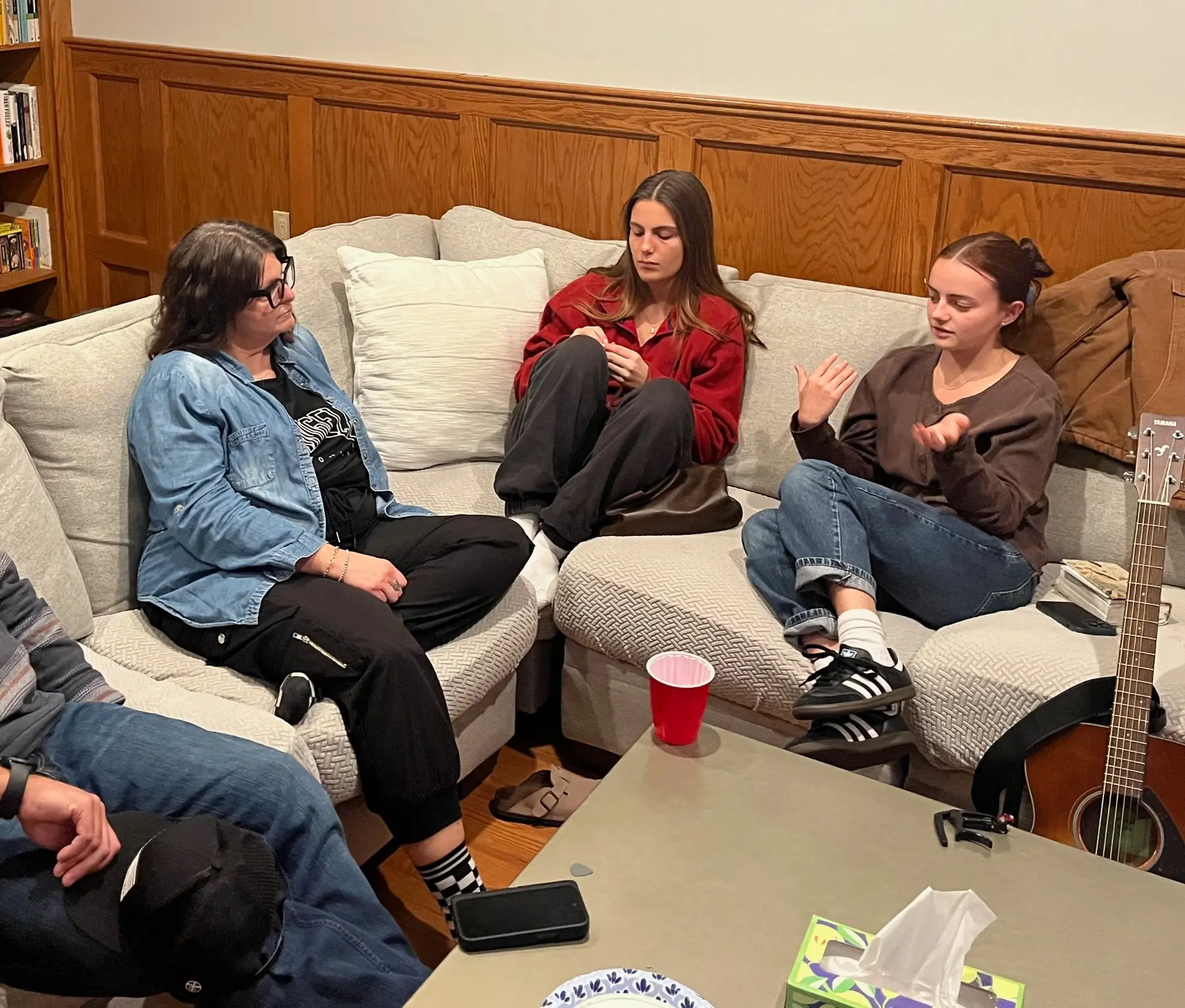 Three women in a mentoring conversation at Haven House