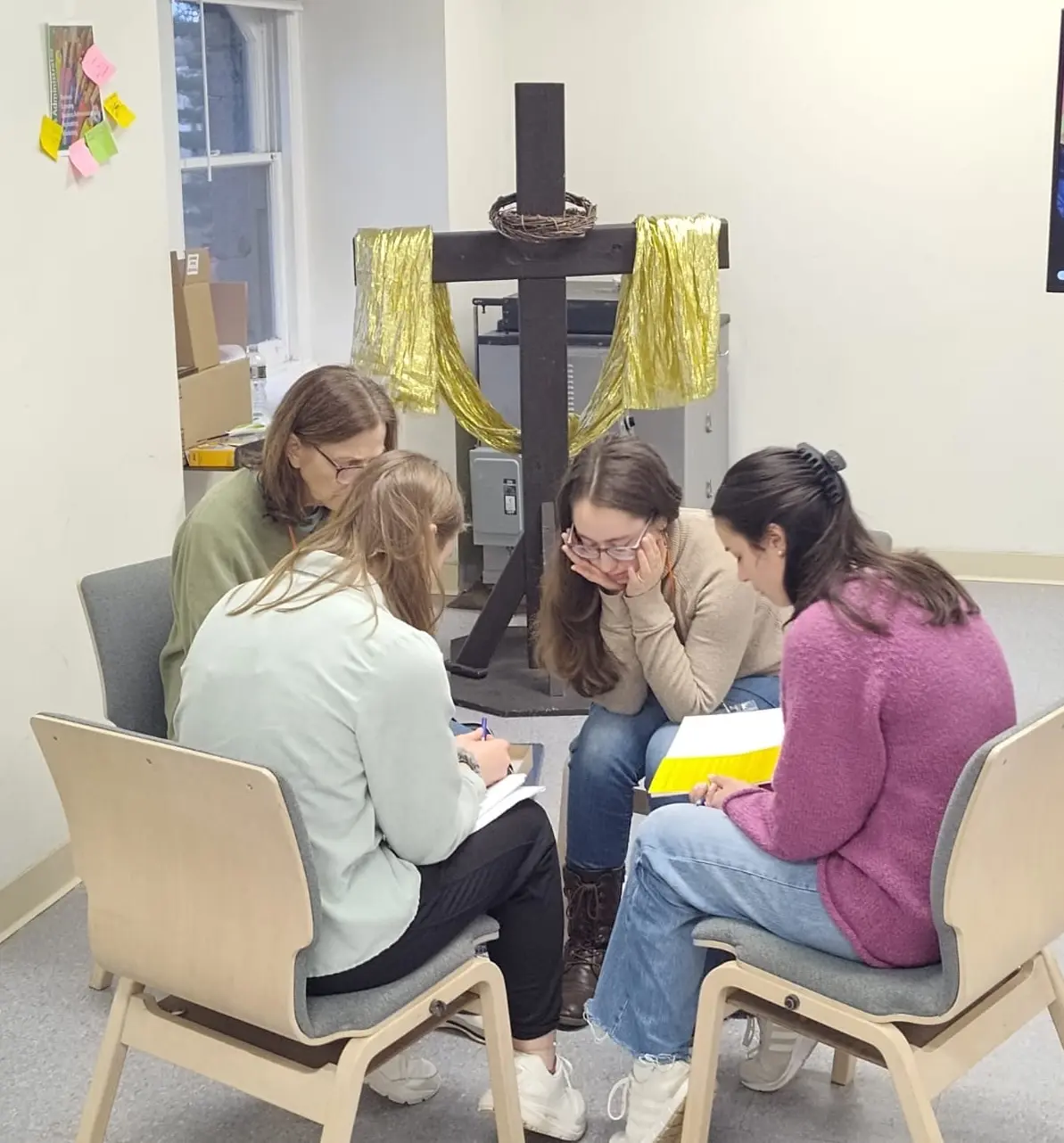 Four women reflecting together in a small group